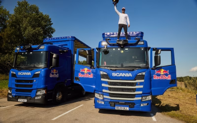 Biker jumps through two moving Scanias in precision stunt